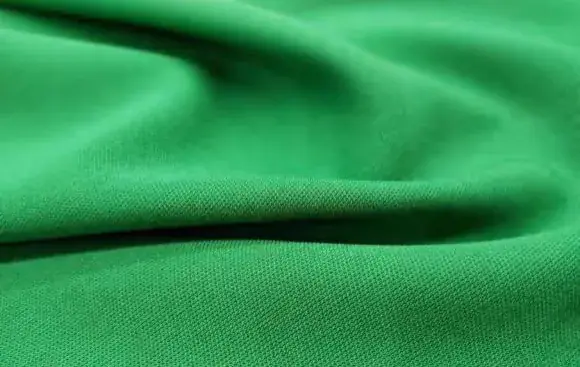 Green suiting fabric close-up